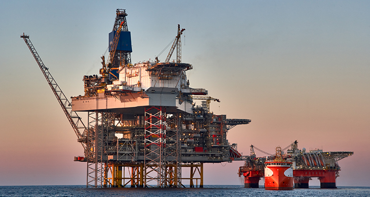 Oil rig in the North Sea against the backdrop of a beautiful sunset.