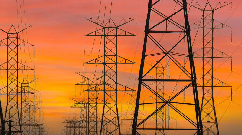 Three rows of power towers with sunrise sky in Los Angeles, California to support EnergyHub article