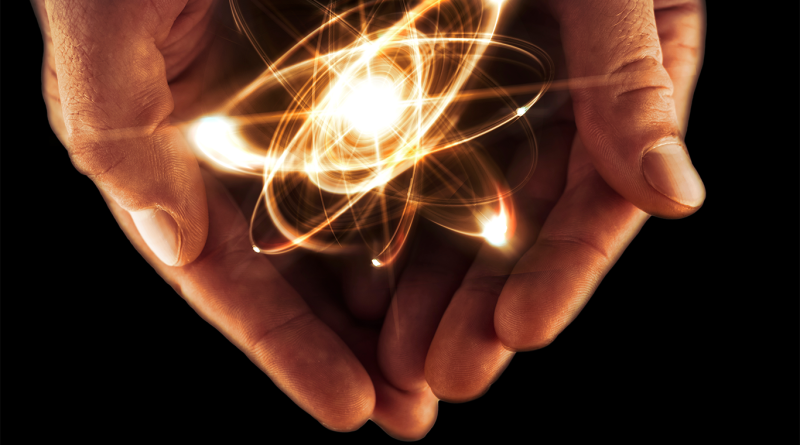 Image of someone with the nuclear energy symbol in their hands to support fusion power article
