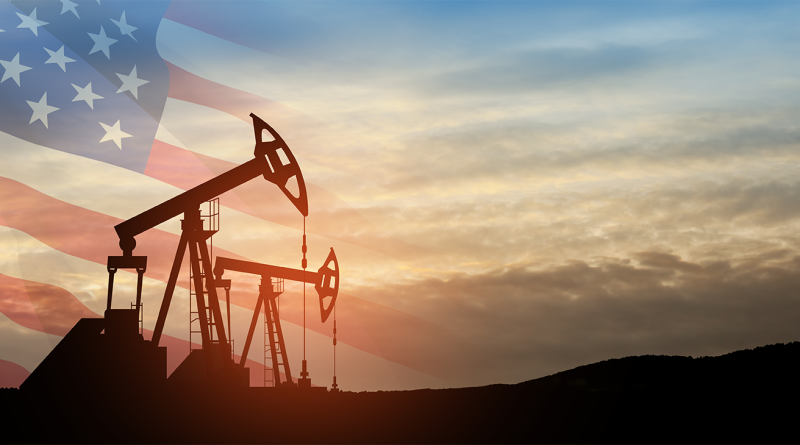Oil drilling derricks in desert oilfield with USA flag in background to support crude oil production article