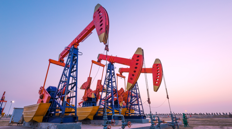 Oil pumpjacks operating at sunset, symbolizing global crude oil production and reserves.