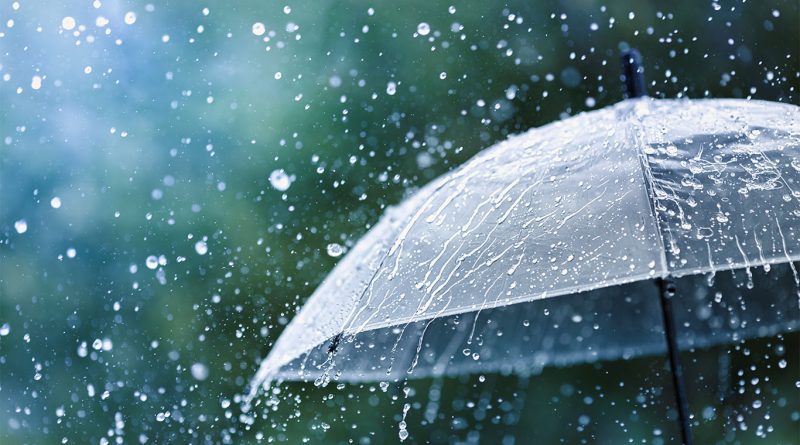 Burbank stormwater represented by heavy rainfall falling down on umbrella