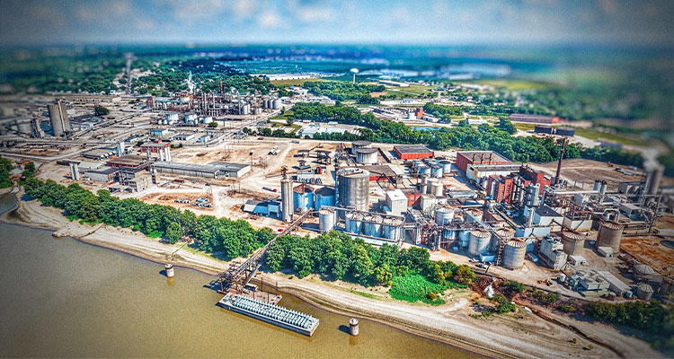 A strategic acquisition is transforming a waste byproduct into a high-margin profit center for Alto Ingredients aerial view of an ethanol plant located along a river