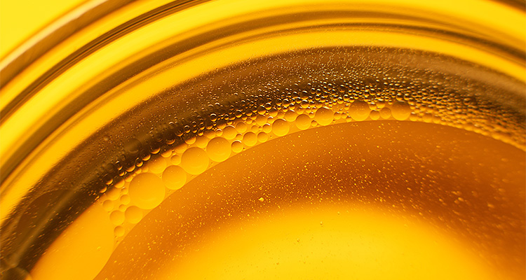 How advanced separation technology is transforming oil & gas resource recovery a close-up photograph of the bubble froth in Oil